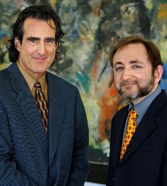 A couple of men in suits

AI-generated content may be incorrect.