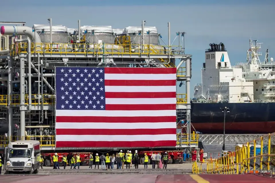 liquefied natural gas facility photo with an American flag hanging.
